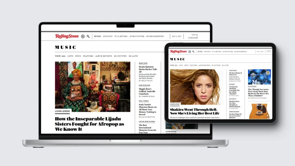 Digital device mockup showing the Rolling Stone website's "Music" landing page. A laptop in the background displays a prominent feature article titled "How the Inseparable Lijadu Sisters Fought for Afropop as We Know It" with an accompanying photo. A tablet overlapping on the right showcases a different layout featuring a cover story about Shakira with a close-up portrait.